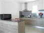 fully equiped kitchen with worktop with fridge, micowave oven, dish washer, coffee machine and toaser