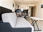 Living room with sofa bed and open kitchen  Residence La Provence
